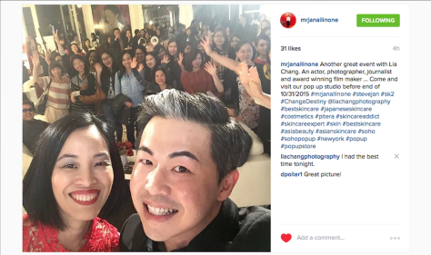Lia Chang and Steve Jan SK-II National Brand Ambassador, take a selfie at the SK-II Pop-up Studio in New York on October 22, 2015. 